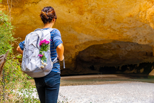 Tourist with backpack in the cave on the path of the Vero river walkways in Alquezar. Huesca Pyrenees photo