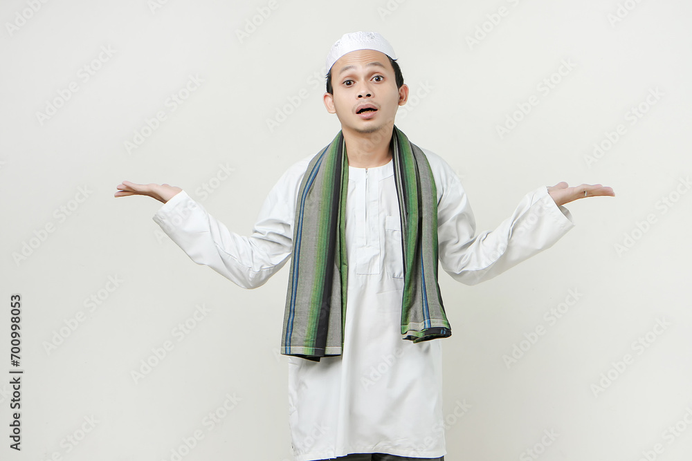 asian muslim man with confused expression. People religious Islam lifestyle concept. celebration Ramadan and ied Mubarak. on isolated background. asian muslim man with confused expression. People religious Islam lifestyle concept. celebration Ramadan and ied Mubarak. on isolated background.