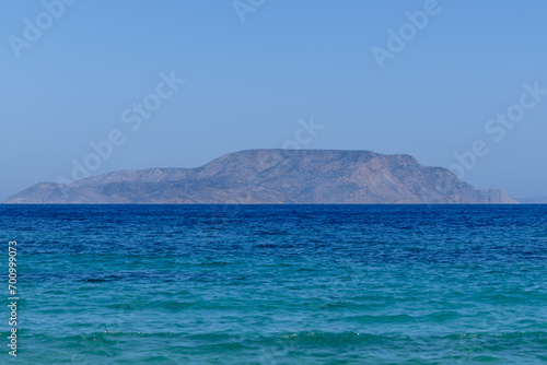 View of the Aegean Sea in Ios Greece and the island of Irakleia in the background