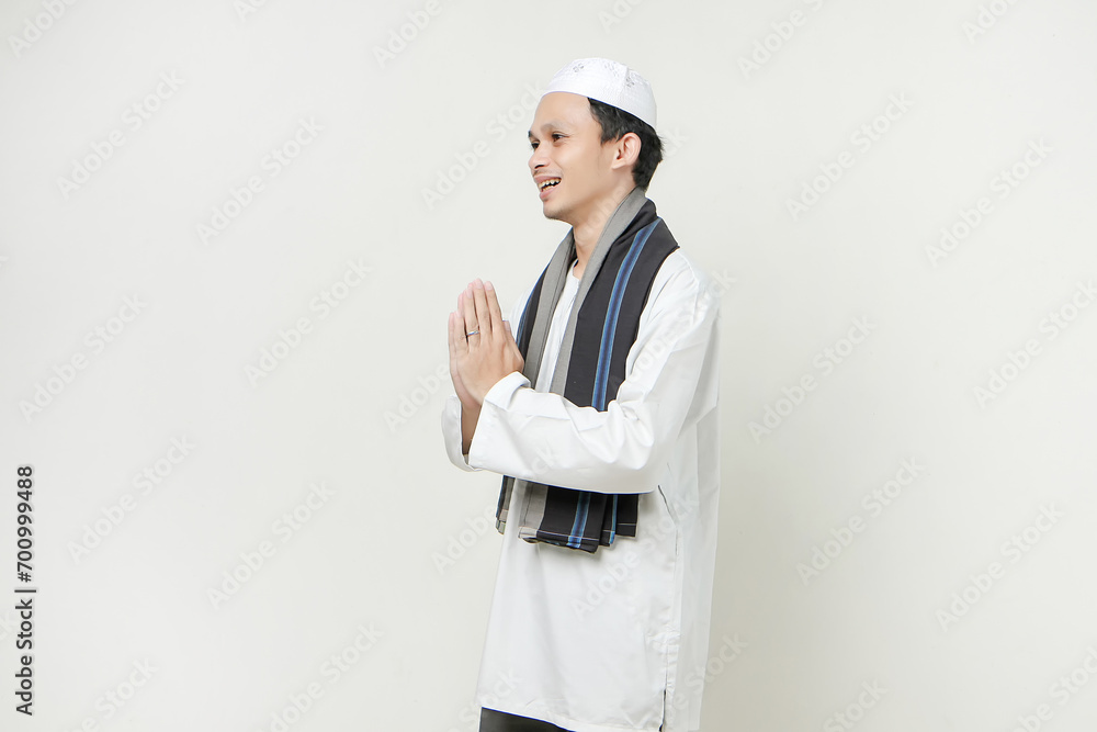 happy asian muslim man greeting gesture. People religious Islam lifestyle concept. celebration Ramadan and ied Mubarak. on isolated background.