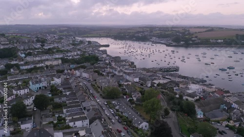 Evening aerial of traditional harbourside houses with quay and boats in the background in Falmouth, Cornwall, UK photo