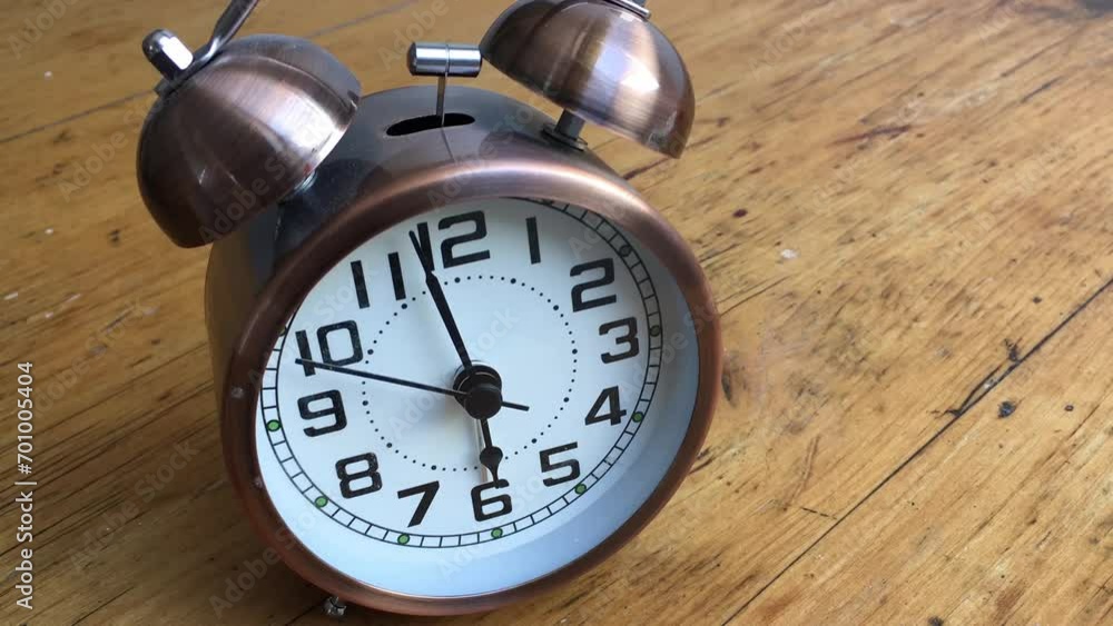 Turn back time . Alarm clock running backwards fast Turn back time . Alarm clock running backwards fast