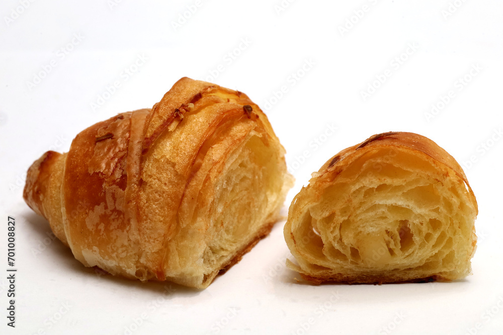 croissant closeup, isolated on white background. croissant closeup, isolated on white background.