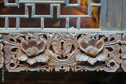 Cornice carvings. It has a flower shape and a metallic rust feel. Enshi Tushi Castle is a unique Tujia Tushi cultural site. Hubei, China. photo