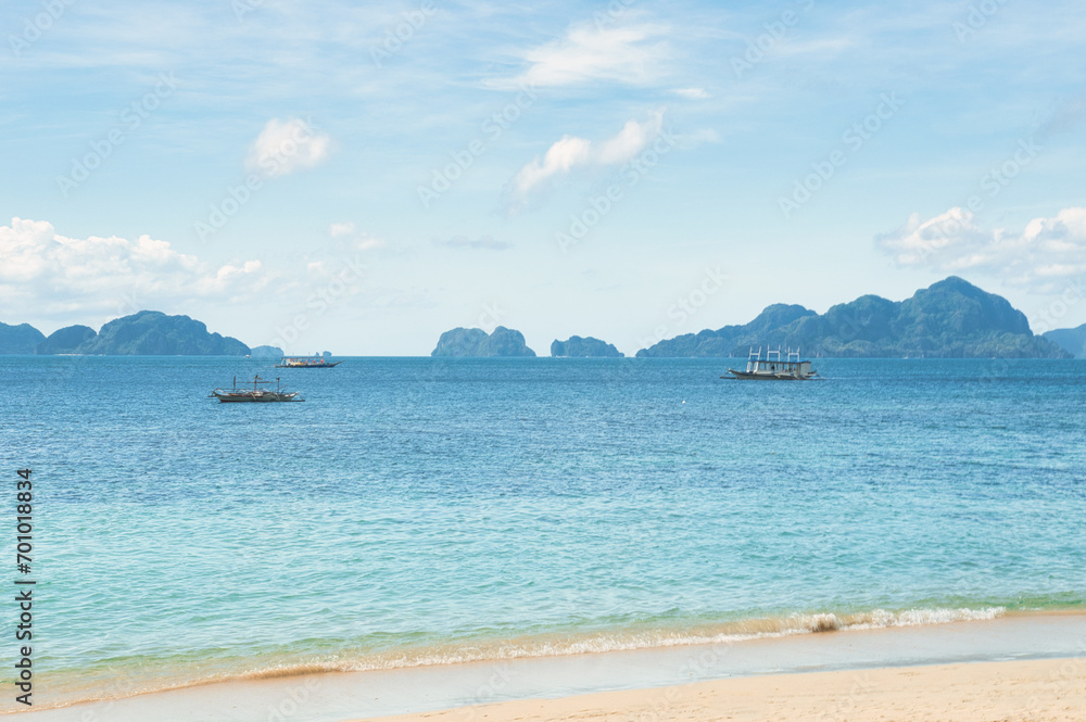 PALAWAN, PHILIPPINES - DECEMBER 21, 2023: Beach landscape in Palawan island, Philippines. Seven Commandos Beach.. 6 million foreign tourists visited Philippines in 2016.