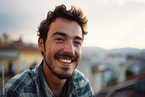 A man with a mustache smiles at the camera. Perfect for professional portraits and personal branding