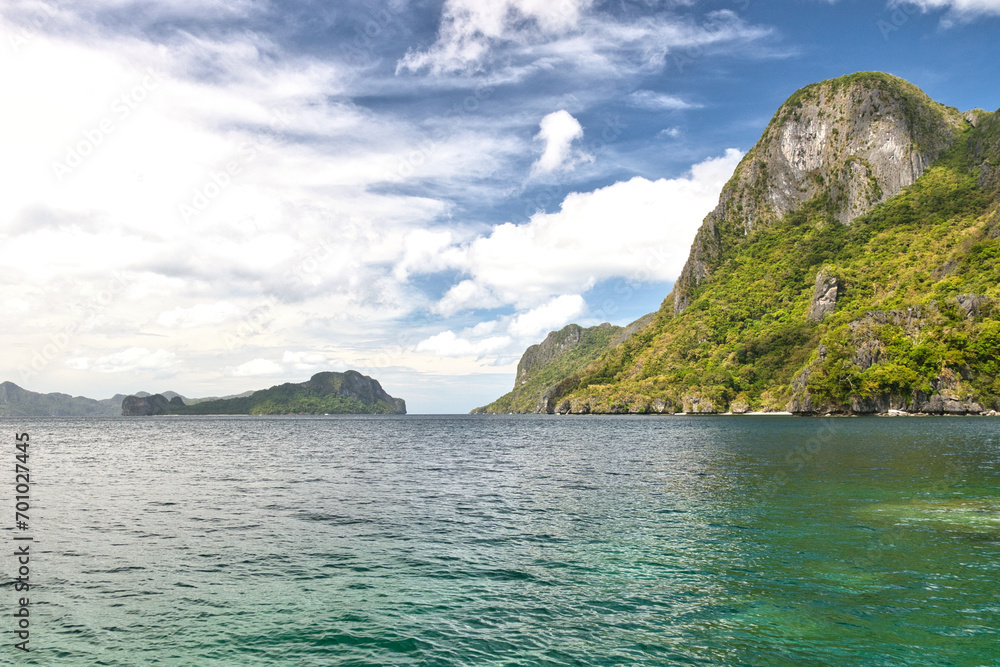 PALAWAN, PHILIPPINES - DECEMBER 21, 2023: Landscape of the beautiful mountain cliff in the sea, El Nido province in Palawan island in Philippines. 6 million tourists visited Philippines in 2016.