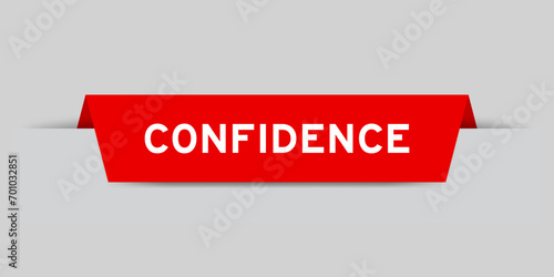 Red color inserted label with word confidence on gray background