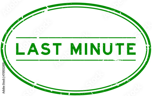 Grunge green last minute word oval rubber seal stamp on white background