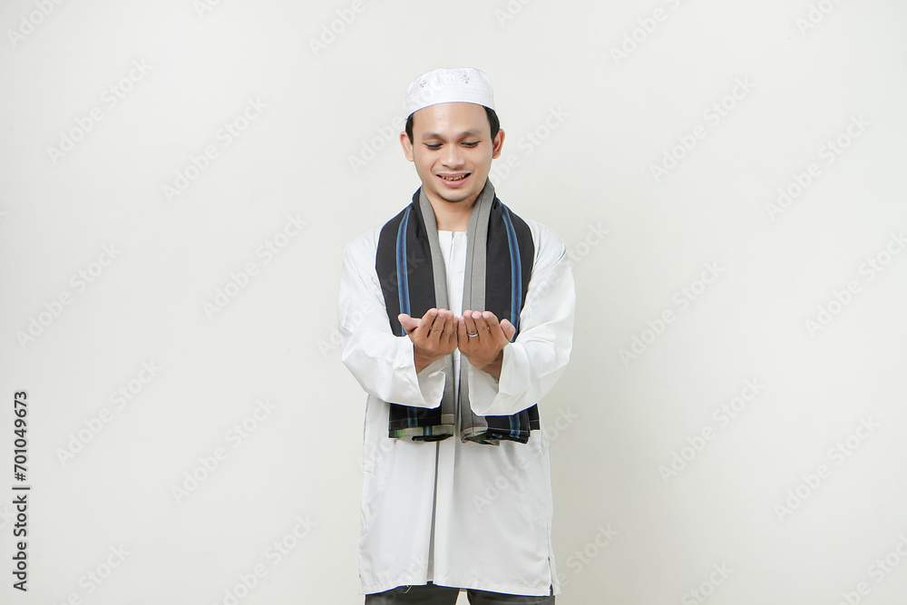asian muslim man with presenting hand gesture. People religious Islam lifestyle concept. celebration Ramadan and ied Mubarak. on isolated background. asian muslim man with presenting hand gesture. People religious Islam lifestyle concept. celebration Ramadan and ied Mubarak. on isolated background.