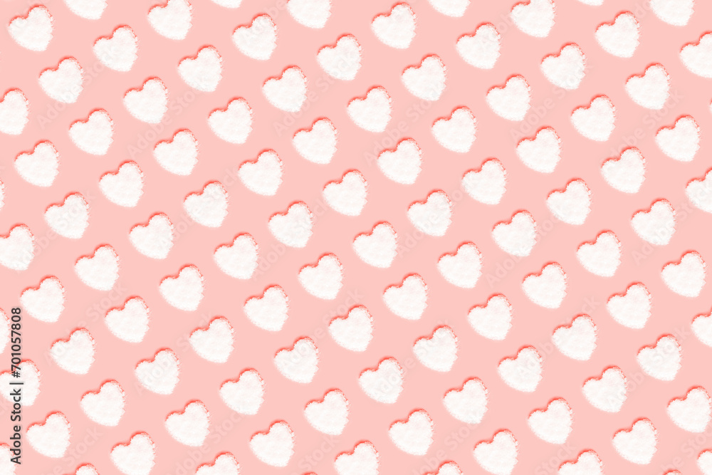 Pattern with hearts made of snow on pink background. Valentines day concept. Top view, flat lay