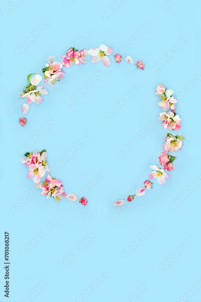 Floral Spring Blossom Wreath design for Beltane, Easter, Mothers Day, birthday for card, logo, gift tag or invitation on pastel blue.