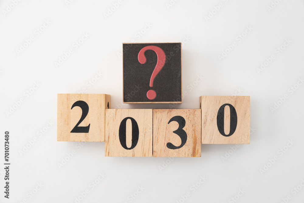 Number 2030 and question mark written on wooden blocks isolated on white background Number 2030 and question mark written on wooden blocks isolated on white background