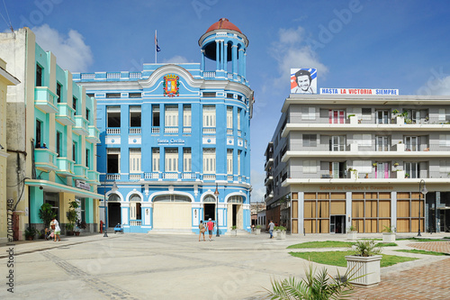Town square known as Plaza de los Trabajadores, one building featuring on top a large photograph of Ernesto Che Guevara, famous revolutionary and political figure, in Camaguey, Cuba photo
