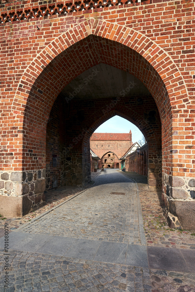 medieval gate and walls made of stone and brick in the city of Neubrandenburg
