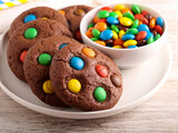Chocolate cookies with color candies.
