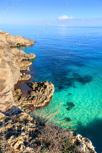 The most beautiful Apulian coast in Italy: Cala Corvino. Typical coastline near Monopoli : high and rocky coast characterized by small sandy coves with cliffs, rocky arches and sea caves.