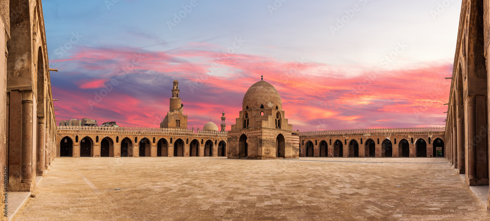 Inner yard of Mosque Ibn Tulun, wonderful sunset of a famous place of Cairo, Egypt