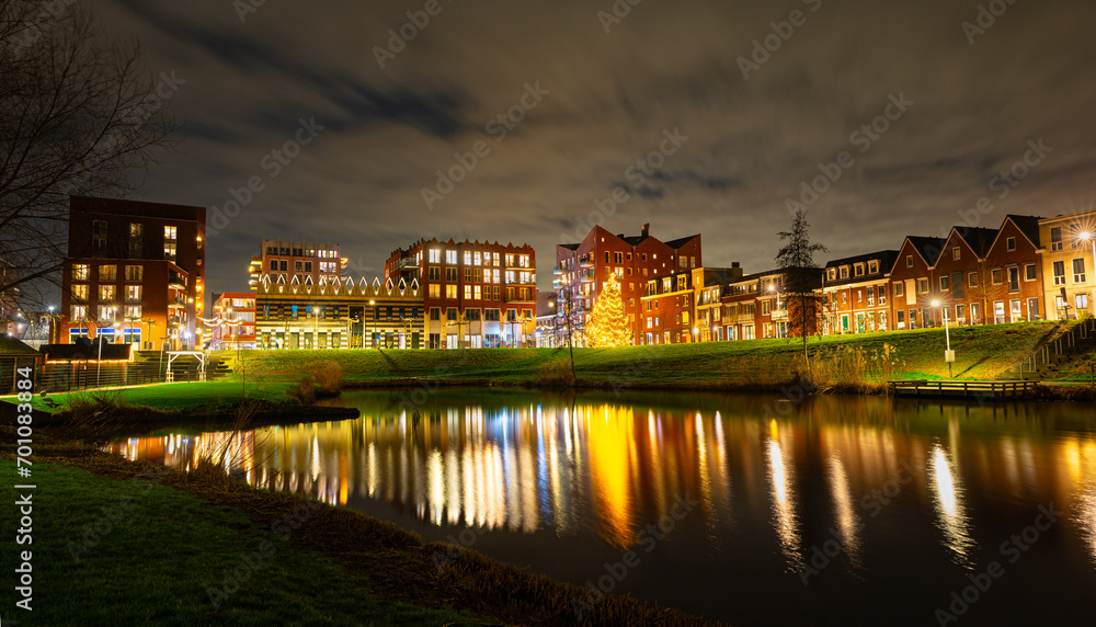 Scenic night view of illuminated buildings in the centre of the town of Waddinxveen, The Netherlands.