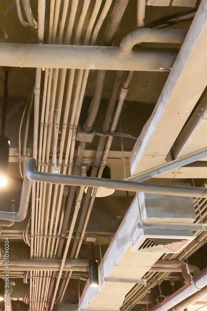 Fototapeta premium A thin pipe is EMT metal conduit or EMT zinc-plated pipe. Steel plates, either hot- or cold-rolled, are used to make it. or a sheet of galvanized steel The inside surface has an enamel coating.