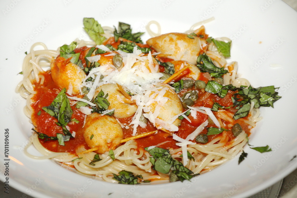 Squid tubes stuffed with pecorino, breadcrumbs, capers, pasta, tomato sauce, basil, garlic, parsley, Italian dish, Squid tubes stuffed with pecorino, breadcrumbs, capers, pasta, tomato sauce, basil, garlic, parsley, Italian dish,