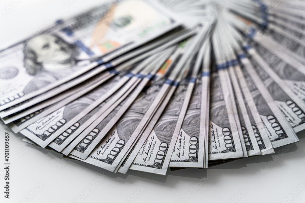 Stacks of Cash on a Clean White Table. A bunch of money sitting on top of a white table Stacks of Cash on a Clean White Table. A bunch of money sitting on top of a white table