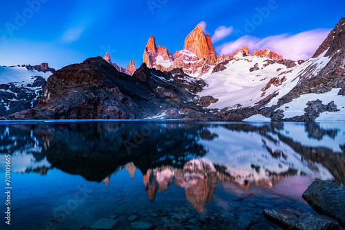 Sunrise of the famous laguna de los tres in the foreground and Fitz Roy mountain in red in the background, near El Chalten in the Argentina part of Patagonia  photo