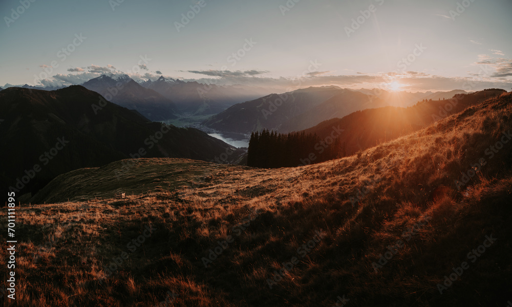 Mountain landscape in Zell am See with lake and Kitzsteinhorn at sunset, Salzburg Land, Austria