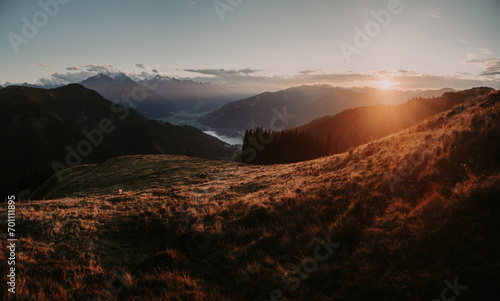 Mountain landscape in Zell am See with lake and Kitzsteinhorn at sunset, Salzburg Land, Austria