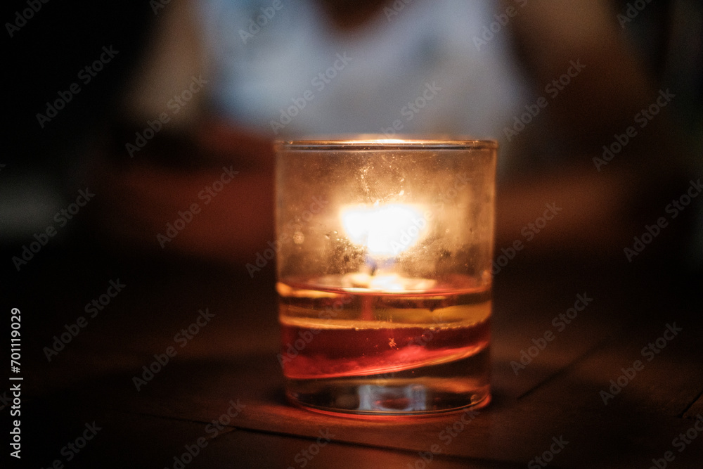 Lit Candle in Small Cup Lit Candle in Small Cup