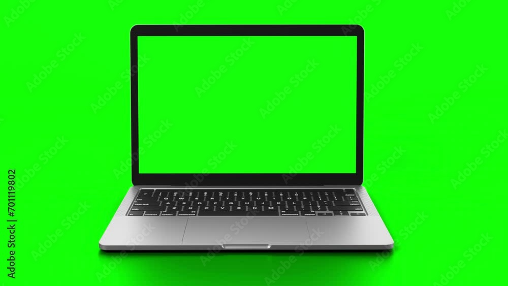 Laptop with green screen on display rotates into view in front of greenscreen.
