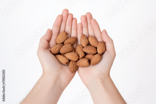 Hands Holding Healthy Almond Nuts Isolated on a White Background
