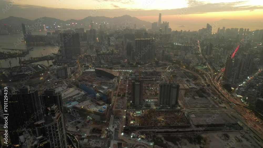 Seaside commercial and residential construction project in Kai Tak Sports Park Cruise Terminal Hong Kong Kowloon city, Kwun Tong and Kowloon Bay near Victoria harbor, Aerial drone sunset dust gloaming Seaside commercial and residential construction project in Kai Tak Sports Park Cruise Terminal Hong Kong Kowloon city, Kwun Tong and Kowloon Bay near Victoria harbor, Aerial drone sunset dust gloaming