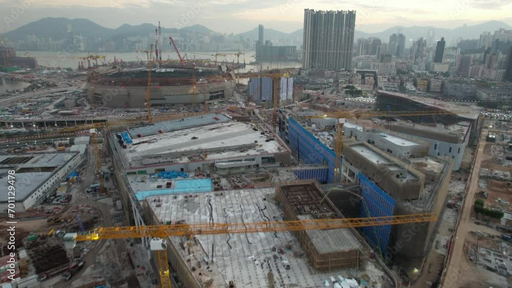 Seaside commercial and residential construction project in Kai Tak Sports Park Cruise Terminal Hong Kong Kowloon city, Kwun Tong and Kowloon Bay near Victoria harbor, Aerial drone sunset dust gloaming Seaside commercial and residential construction project in Kai Tak Sports Park Cruise Terminal Hong Kong Kowloon city, Kwun Tong and Kowloon Bay near Victoria harbor, Aerial drone sunset dust gloaming