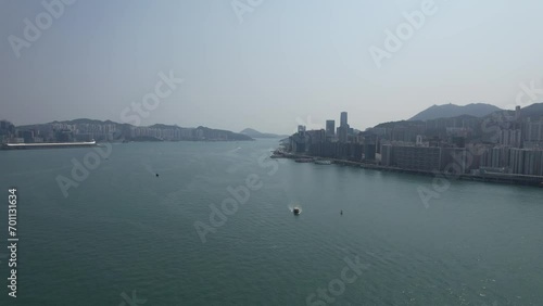 Aerial drone Skyview shot in Tsim Sha Tsui Whampoa Hung Hom commercial area, Hong Kong Victoria Harbour Financial Kowloon Peninsula and Central Wan Chai Causeway Bay photo