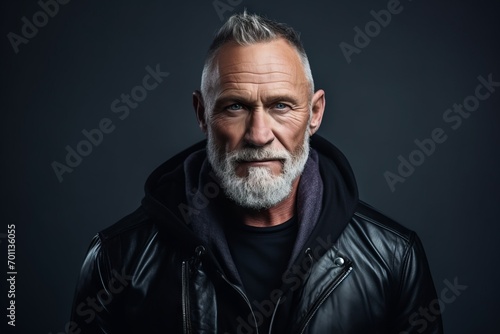 Portrait of a stylish senior man in a leather jacket. Men's beauty, fashion.