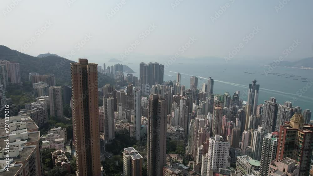 City Skyview in Hong Kong Island 4K Aerial shot of the peak premium residential mansion villa area at mid level and the central financial business along the sides of the Victoria Harbour City Skyview in Hong Kong Island 4K Aerial shot of the peak premium residential mansion villa area at mid level and the central financial business along the sides of the Victoria Harbour