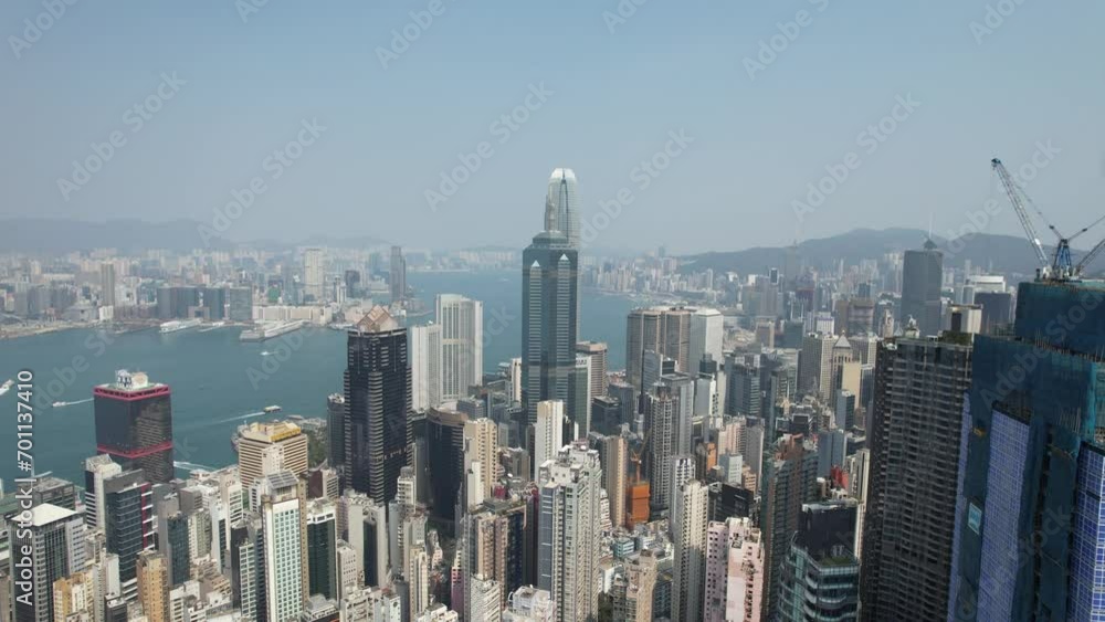 City Skyview in Hong Kong Island 4K Aerial shot of the peak premium residential mansion villa area at mid level and the central financial business along the sides of the Victoria Harbour City Skyview in Hong Kong Island 4K Aerial shot of the peak premium residential mansion villa area at mid level and the central financial business along the sides of the Victoria Harbour