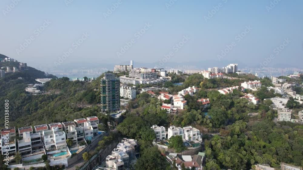 City Skyview in Hong Kong Island 4K Aerial shot of the peak premium residential mansion villa area at mid level and the central financial business along the sides of the Victoria Harbour City Skyview in Hong Kong Island 4K Aerial shot of the peak premium residential mansion villa area at mid level and the central financial business along the sides of the Victoria Harbour