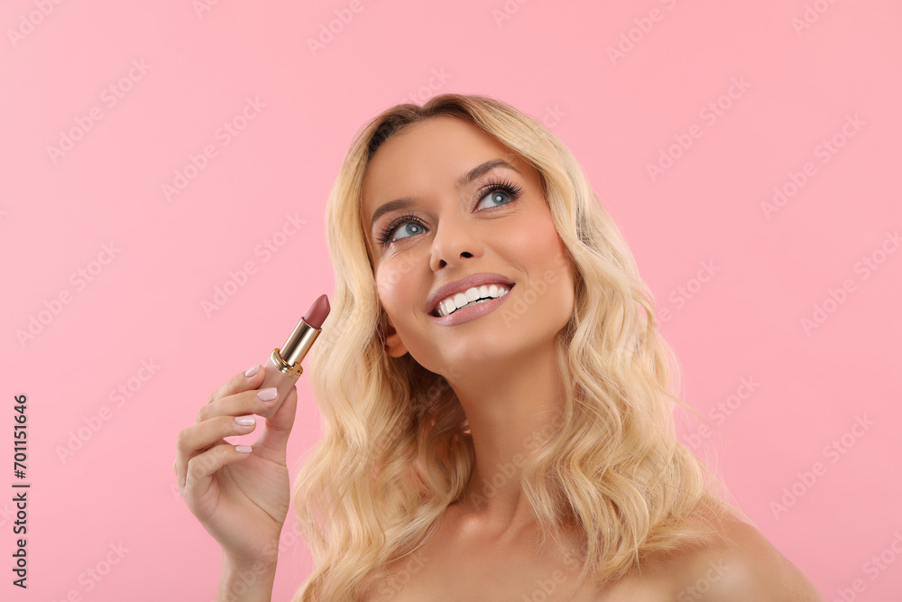 Beautiful makeup. Smiling woman with lipstick on pink background Beautiful makeup. Smiling woman with lipstick on pink background
