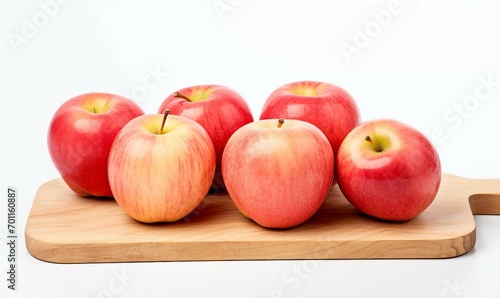 red apples on wooden cutting board