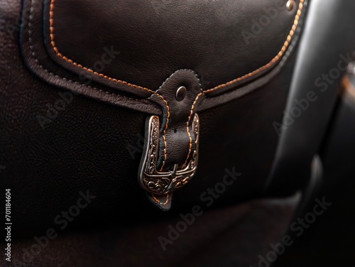 Close-up of a metal clasp on a leather bag