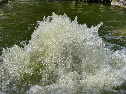  Water oxygenation flowing from a fountain in pond fish © Suphatthra China
