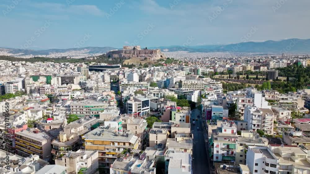 Aerial view of Ruins of the iconic temple complex Acropolis of Athens on a rocky hilltop in Greece. View from above the old Athens buildings and Historical landmark Parthenon on archaeological site. Aerial view of Ruins of the iconic temple complex Acropolis of Athens on a rocky hilltop in Greece. View from above the old Athens buildings and Historical landmark Parthenon on archaeological site.