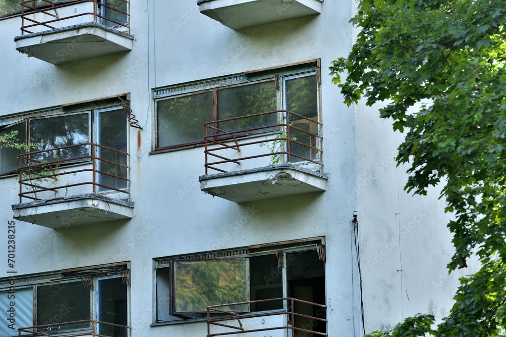View of the old iron concrete balconies of the destroyed building