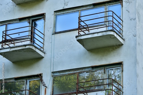 View of the old iron concrete balconies of the destroyed building