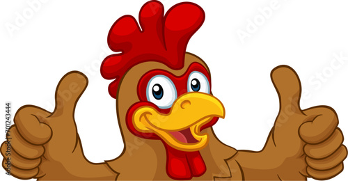 Photo A chicken rooster cockerel bird cartoon character peeking over a sign and giving