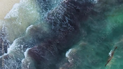 Aerial view of a tropical beach after a storm, ocean waves photo