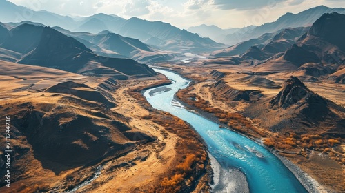 Aerial View of Winding River through Mountains