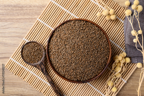 Perilla seed in bowl with spoon, Healthy herbal seed ingredients in Asian food, Table top view